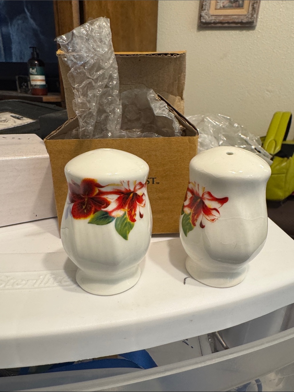 White Ceramic Salt and Pepper Shakers with Red Floral Design